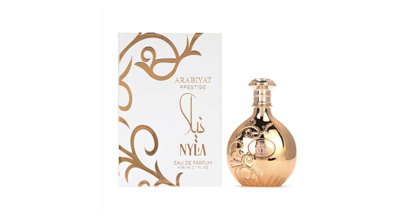 Nyla by Arabiyat Prestige 80ml eau de parfum — gold bottle next to its white and gold box